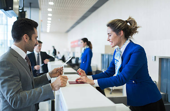 business man in check in counter with boarding pass.